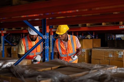 Foreman and worker in warehouse checking carton box barcode store at steel shelf ready to deliver Supply Chain Transparency