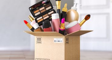 Cardboard box with cosmetics product in front od open door. Buyi 4PL logistics outsourcing strategy